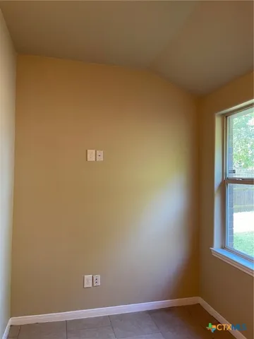 a kitchen with a refrigerator and a sink