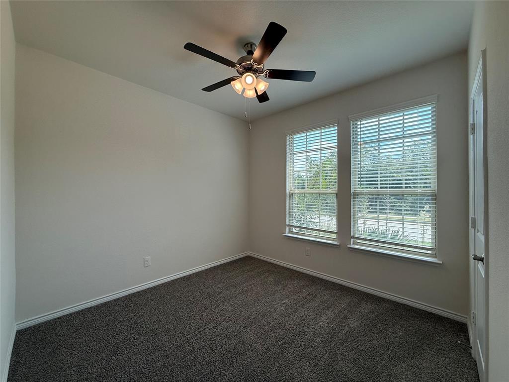 4124 Ellinger Drive Forney, TX 75126 - Photo 17 of 28 a view of an empty room with a window