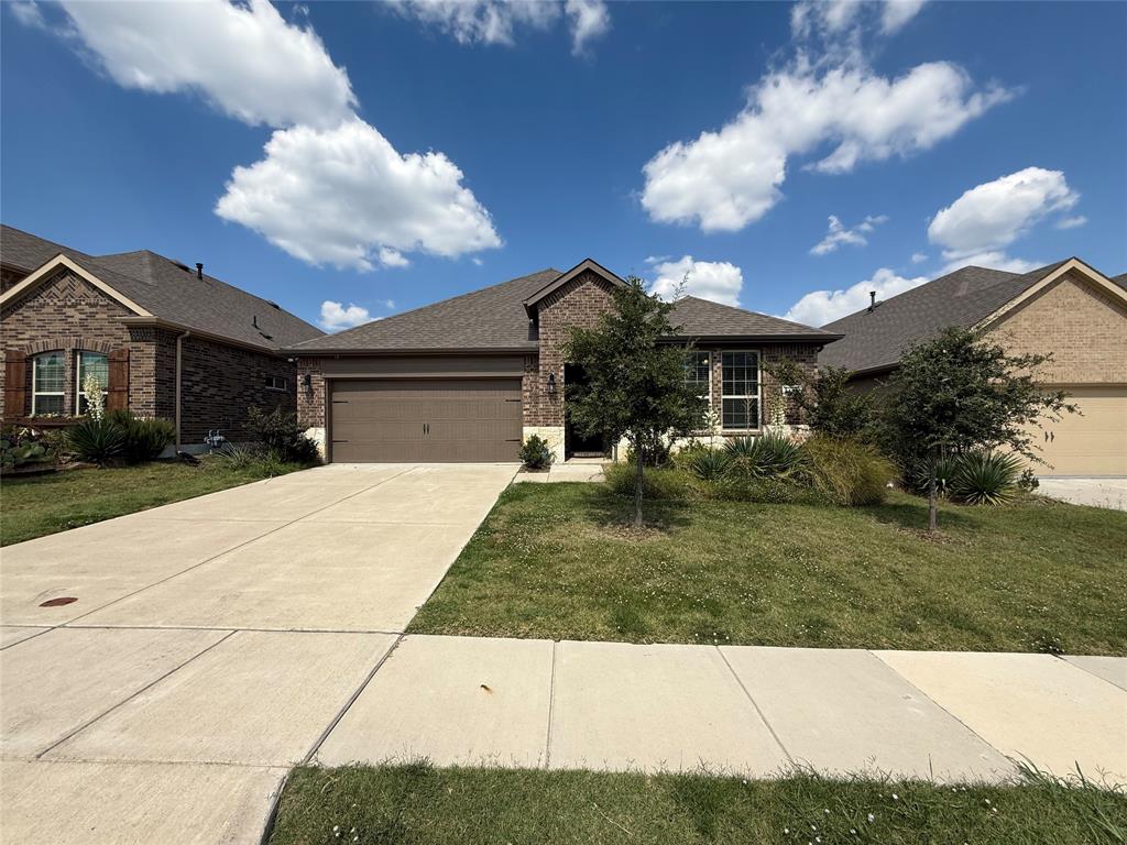 4124 Ellinger Drive Forney, TX 75126 - Photo 2 of 28 a front view of a house with a yard and potted plants