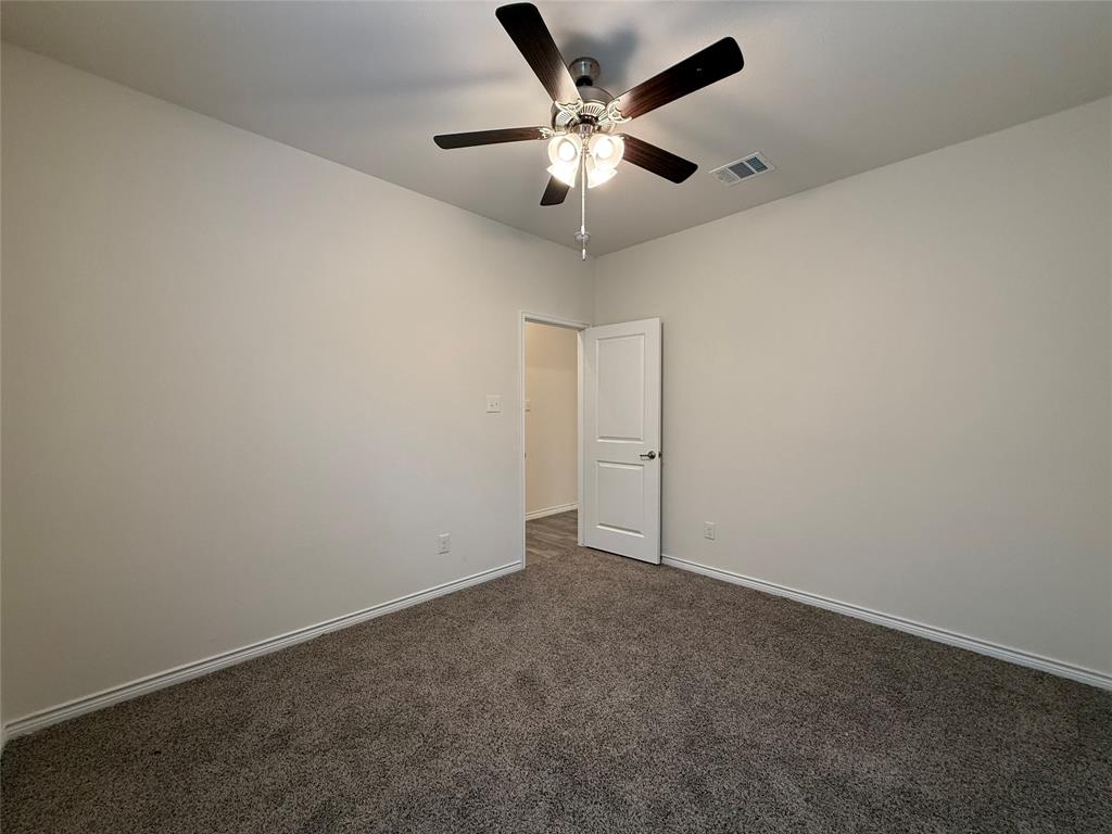 4124 Ellinger Drive Forney, TX 75126 - Photo 21 of 28 an empty room with a ceiling fan and fan
