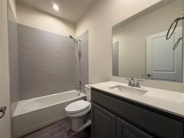 a bathroom with a double vanity sink mirror and shower