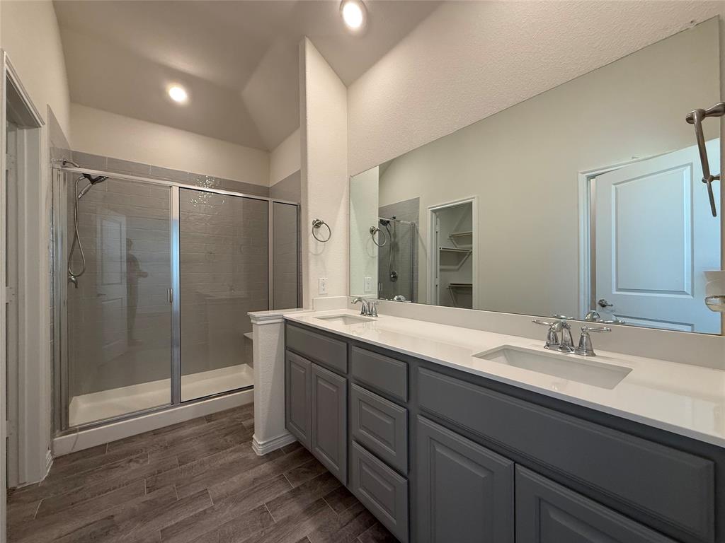 4124 Ellinger Drive Forney, TX 75126 - Photo 23 of 28 a bathroom with a double vanity sink mirror and shower