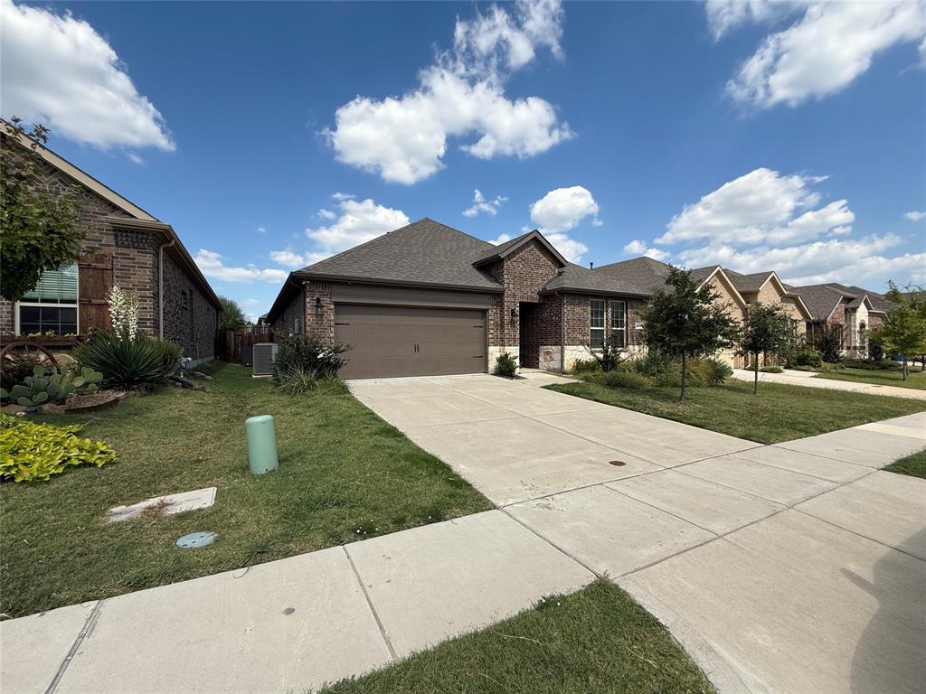4124 Ellinger Drive Forney, TX 75126 - Photo 3 of 28 a front view of a house with a yard