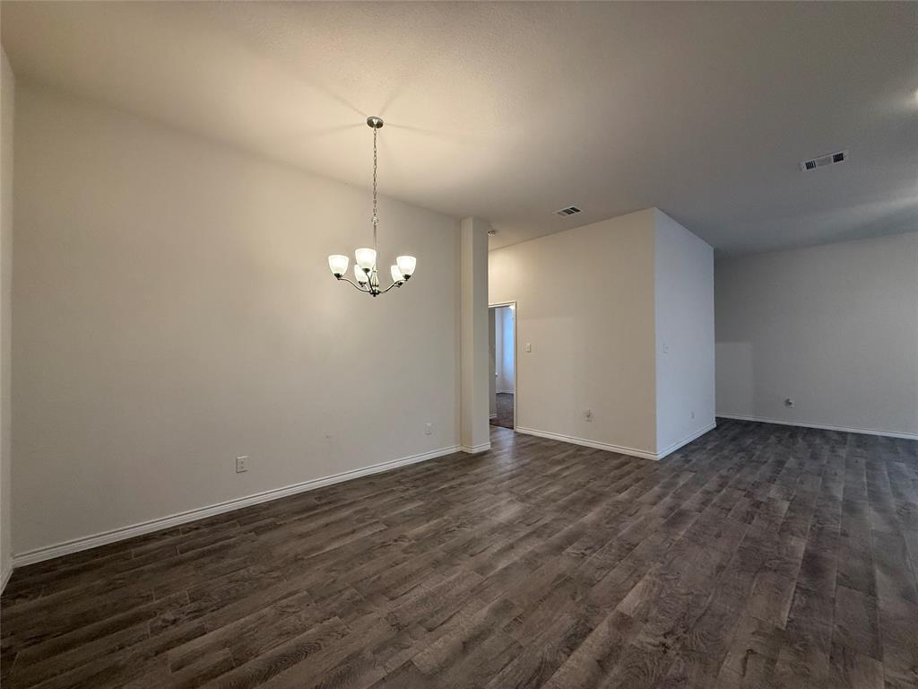 4124 Ellinger Drive Forney, TX 75126 - Photo 9 of 28 a view of a room with wooden floor and ceiling fan