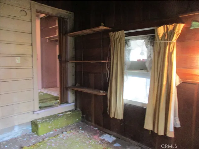 a bathroom with a shower and a sink