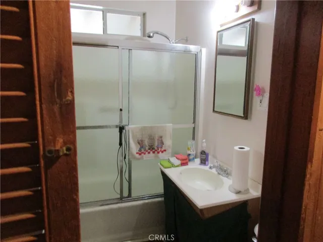 a bathroom with a sink and mirror