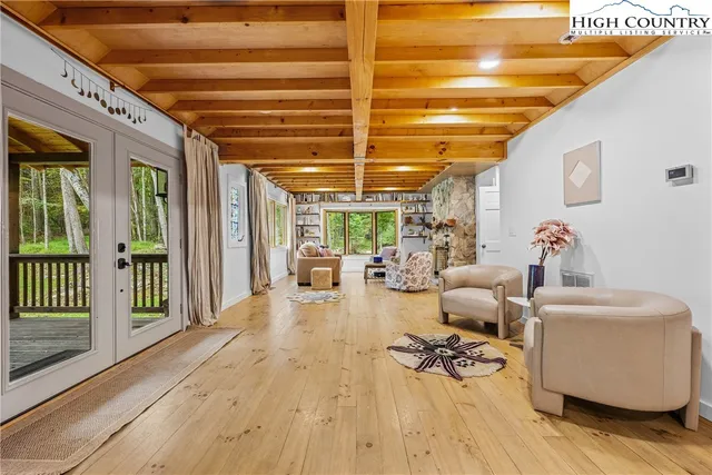 a lobby with furniture and floor to ceiling window