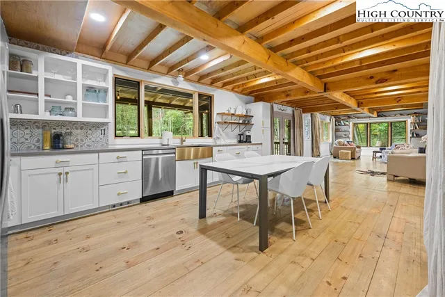 a view of a kitchen and a wooden floor