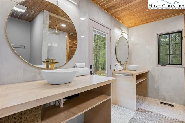 a room with a table and mirror