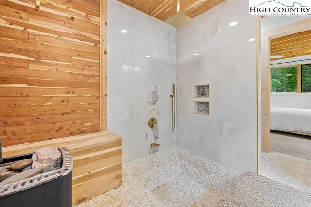 a bathroom with a bathtub and shower
