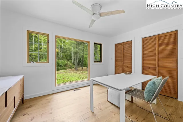 a view of a dining room with furniture window and outside view