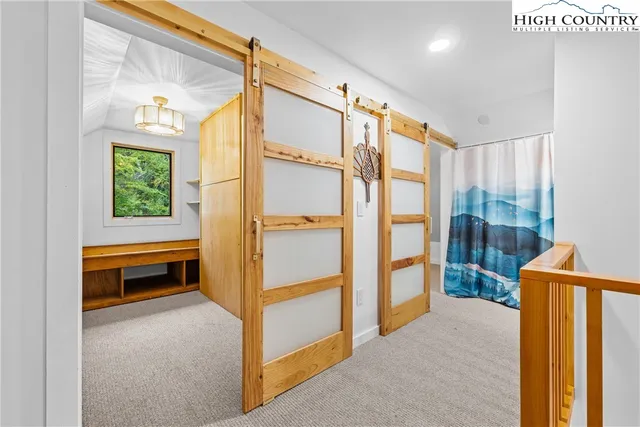 a bathroom with a sink a vanity and a bathtub