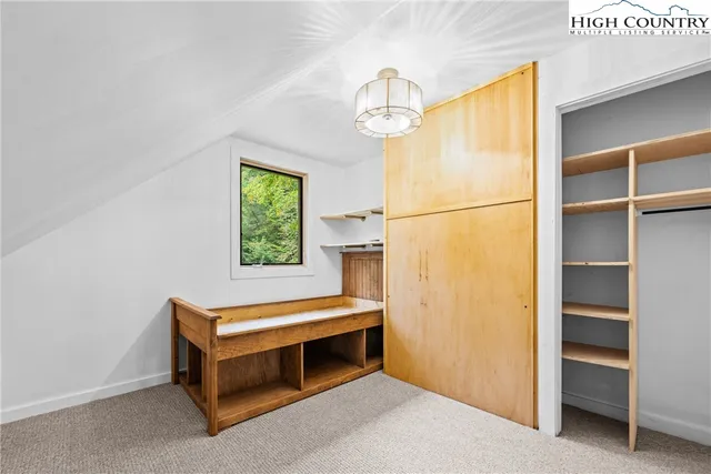 a room with a bed and a window