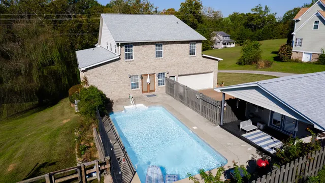 a view of swimming pool from a yard