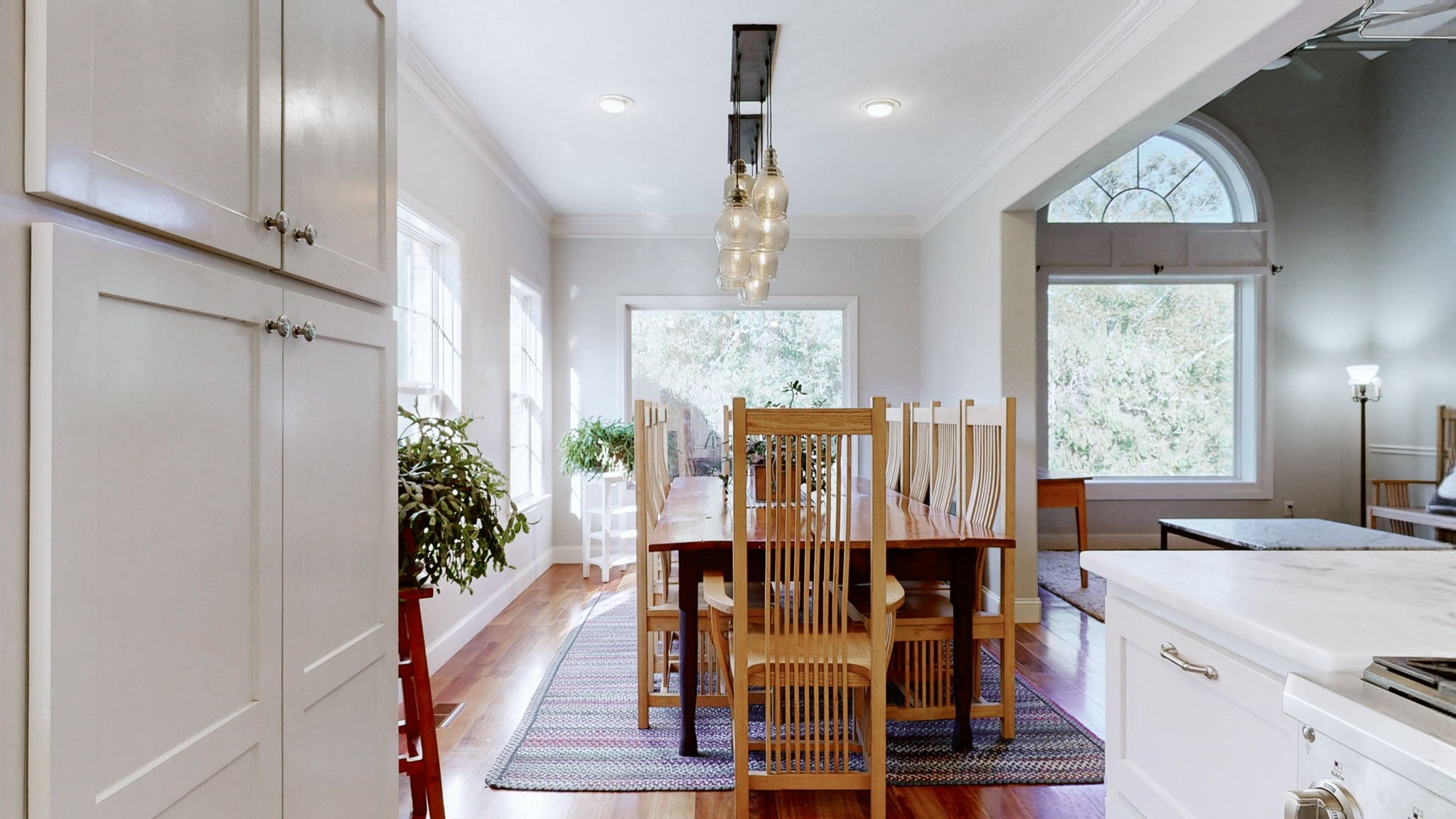 3400 Cobblestone Mills Road Spring Hill, TN 37174 - Photo 12 of 63 a view of dining room kitchen with furniture and wooden floor