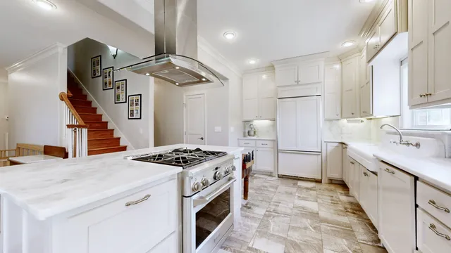 a kitchen with a sink stove and cabinets