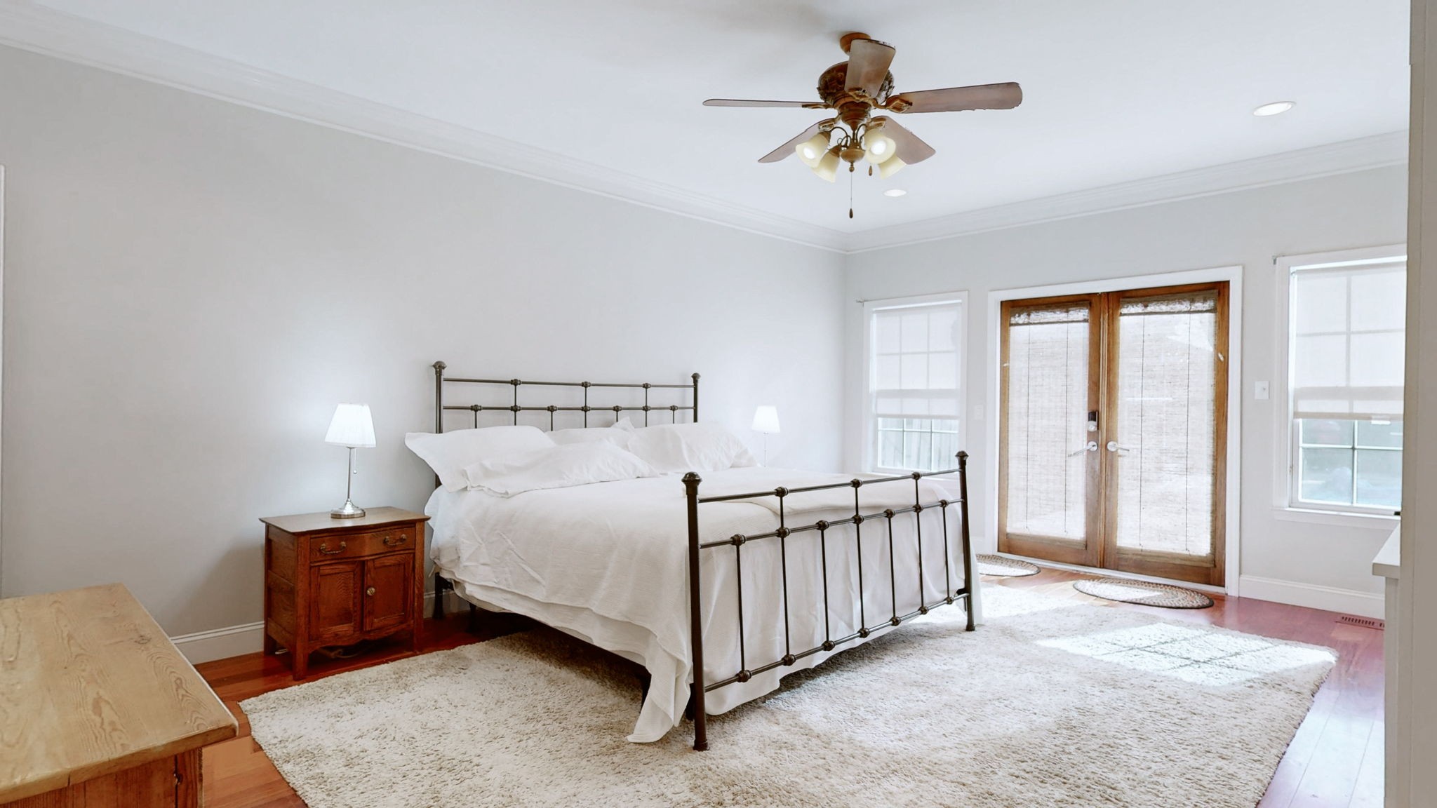 3400 Cobblestone Mills Road Spring Hill, TN 37174 - Photo 18 of 63 a bedroom with a bed and a chandelier