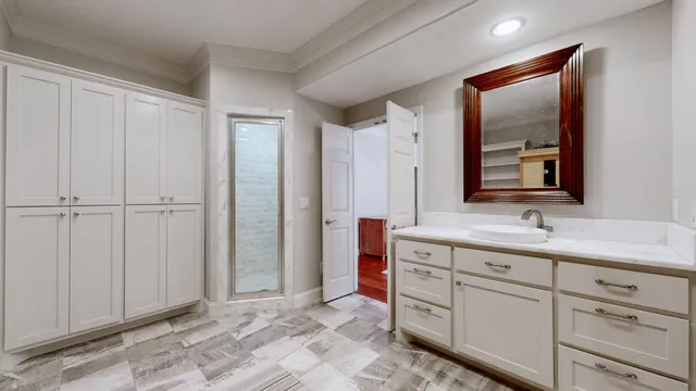 a kitchen with granite countertop a sink a stove and washer