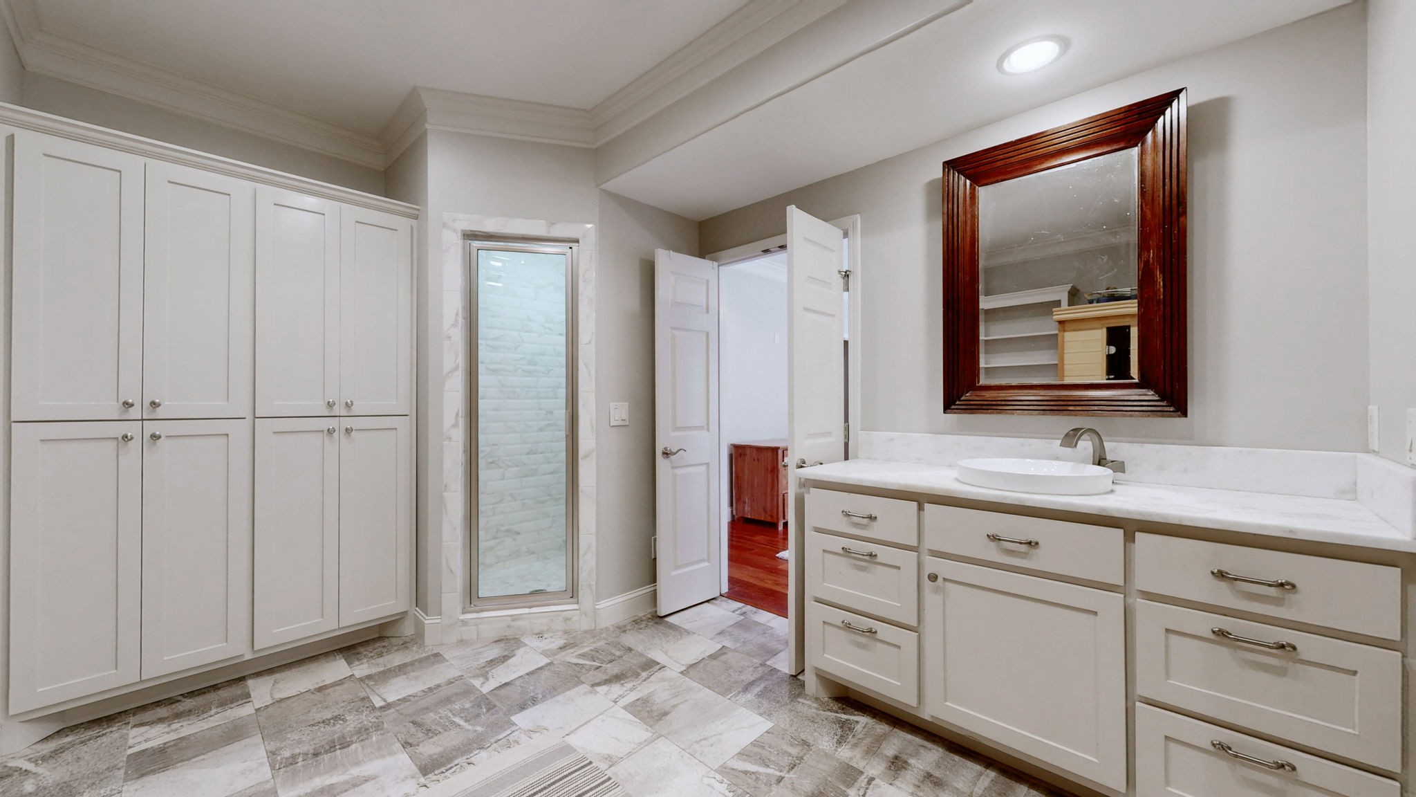 3400 Cobblestone Mills Road Spring Hill, TN 37174 - Photo 19 of 63 a bathroom with a mirror sink and vanity