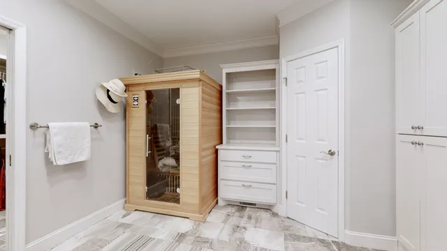 a spacious bedroom with a bed and a couch