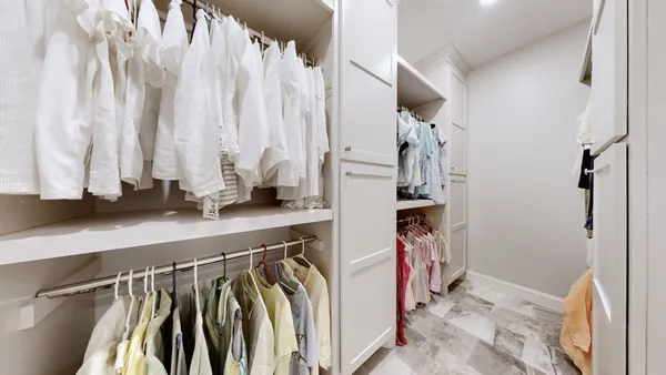 a view of a a dining room with furniture window and wooden floor