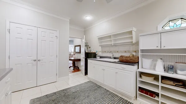 a close view of a sink a washer and dryer