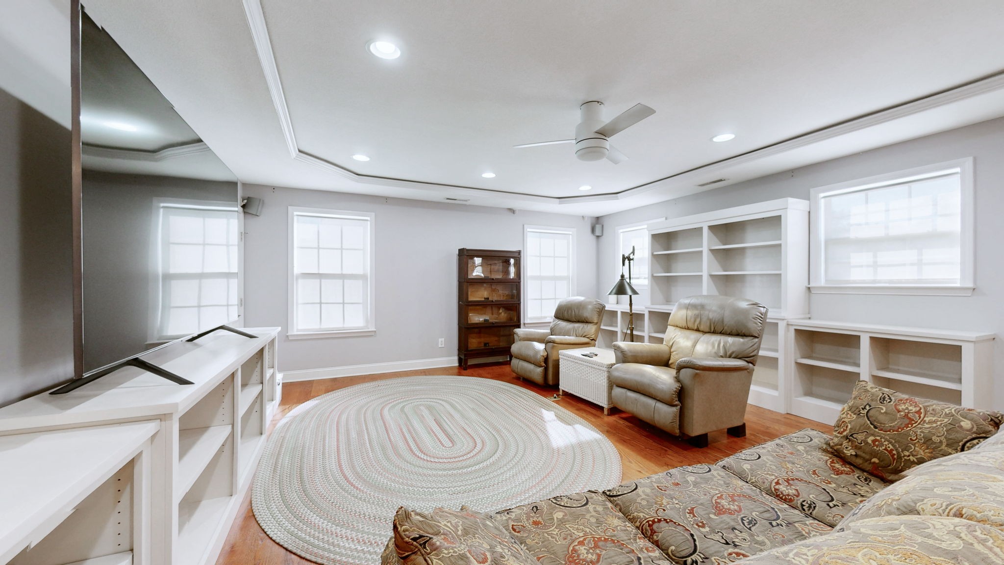 3400 Cobblestone Mills Road Spring Hill, TN 37174 - Photo 24 of 63 a spacious bedroom with a bed and a couch