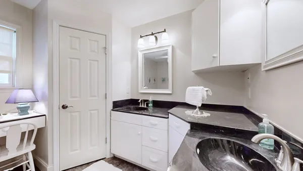 a view of a livingroom with furniture and workspace