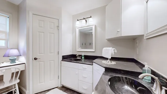 a view of a livingroom with furniture and workspace