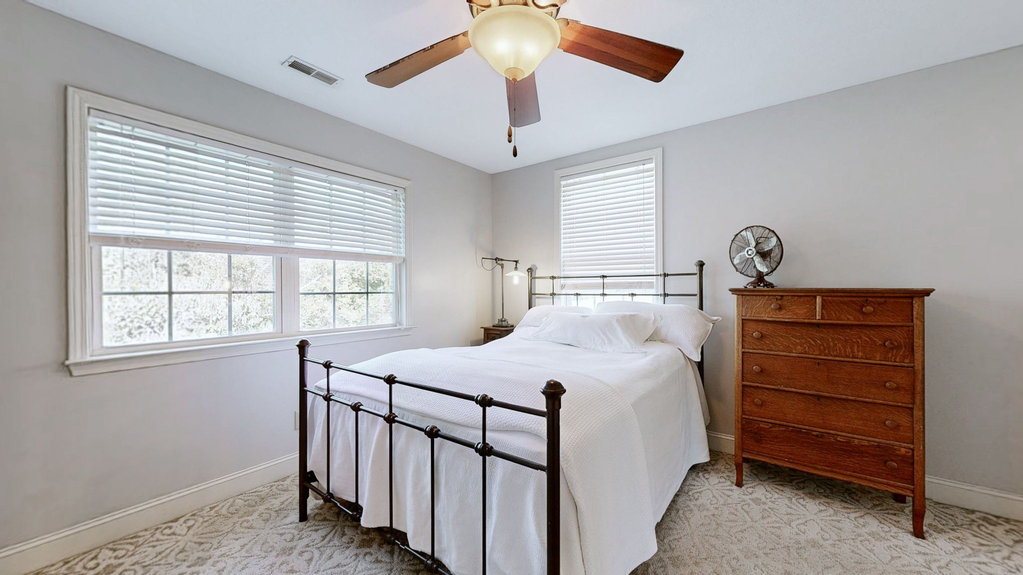 3400 Cobblestone Mills Road Spring Hill, TN 37174 - Photo 30 of 63 a bedroom with a bed and a chandelier