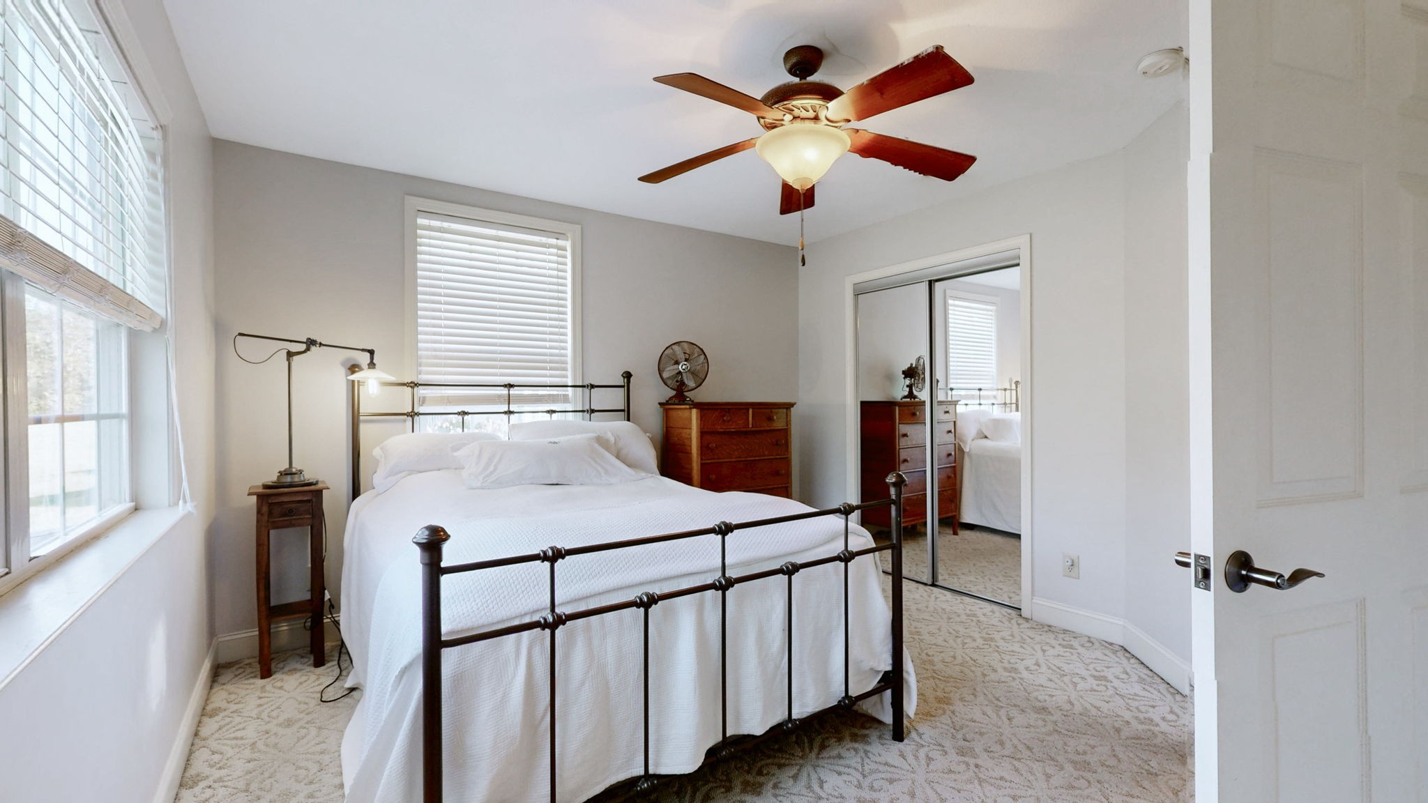 3400 Cobblestone Mills Road Spring Hill, TN 37174 - Photo 31 of 63 a bedroom with a bed a window and a chandelier