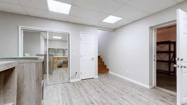 a view of a swimming pool with an outdoor space and seating area