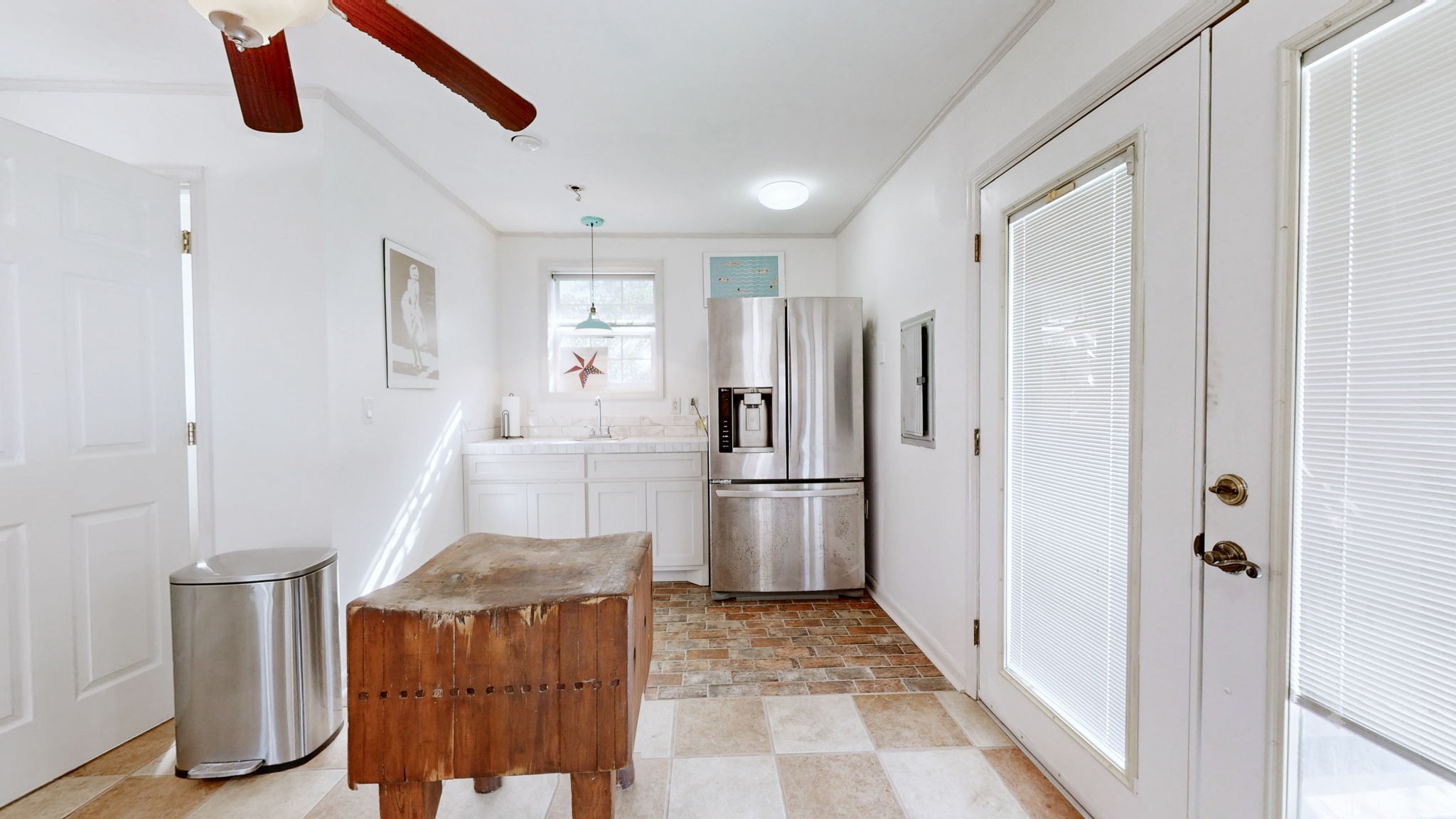 3400 Cobblestone Mills Road Spring Hill, TN 37174 - Photo 37 of 63 a kitchen with a refrigerator and a sink