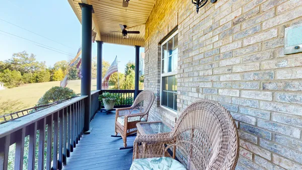 a view of a house with backyard and porch