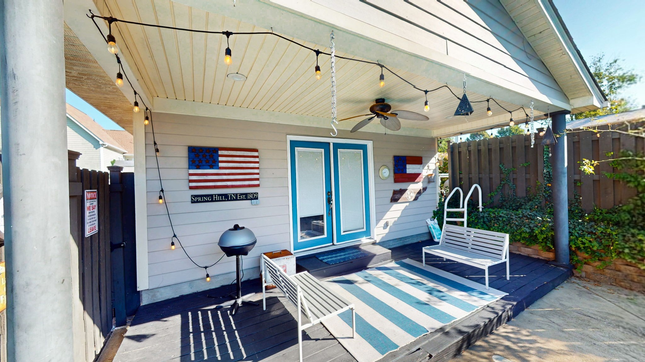 3400 Cobblestone Mills Road Spring Hill, TN 37174 - Photo 44 of 63 a living room with furniture a wooden floor and a chandelier