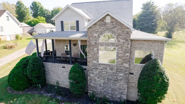 a picture of a bench in front of a wall