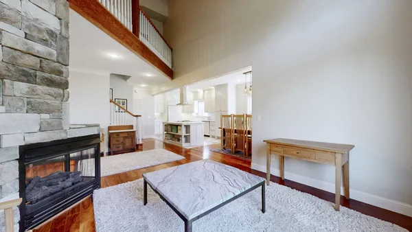 a view of dining room kitchen with furniture and wooden floor