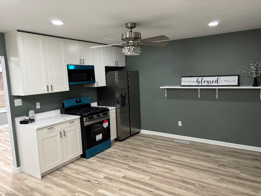 1760 Pine Bluff Road Morris, IL 60450 - Photo 4 of 10 a kitchen with a refrigerator and a stove top oven