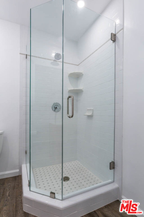 1212 Scenic Drive Glendale, CA 91205 - Photo 12 of 42 a bathroom with a glass shower door