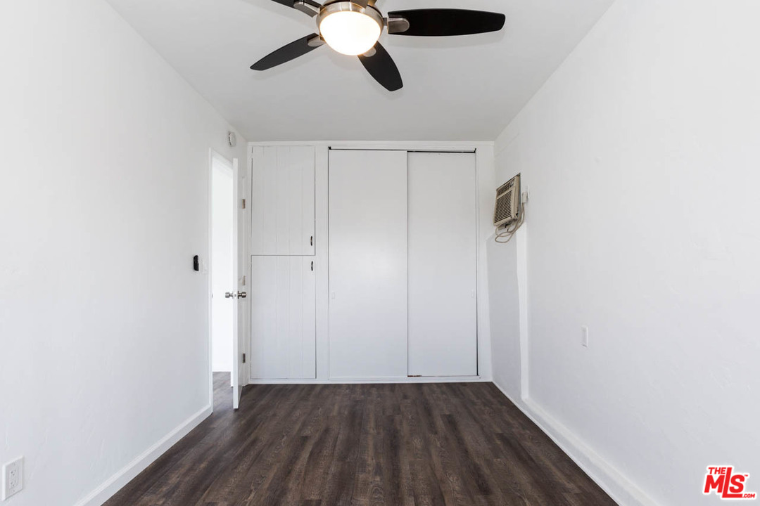 1212 Scenic Drive Glendale, CA 91205 - Photo 13 of 42 an empty room with wooden floor fan and windows