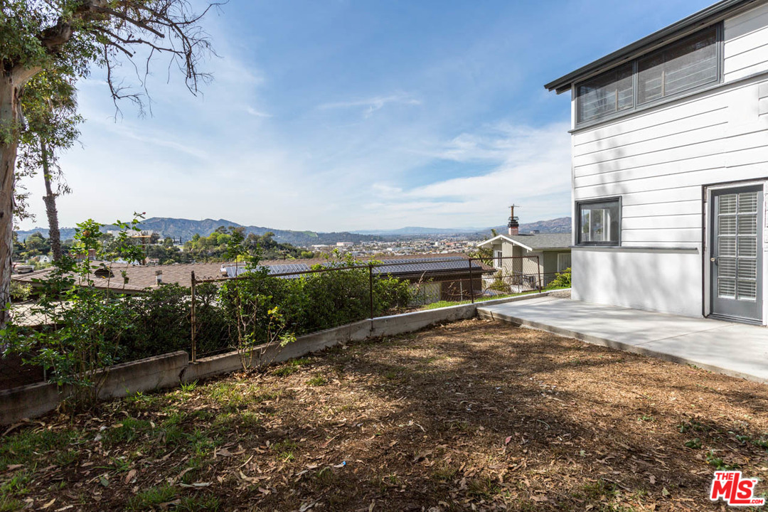 1212 Scenic Drive Glendale, CA 91205 - Photo 17 of 42 a view of a street with a big yard