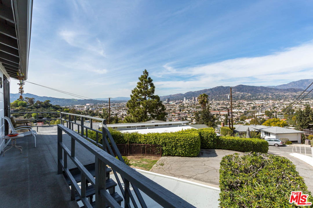 1212 Scenic Drive Glendale, CA 91205 - Photo 19 of 42 a view of a city from a balcony with outdoor seating