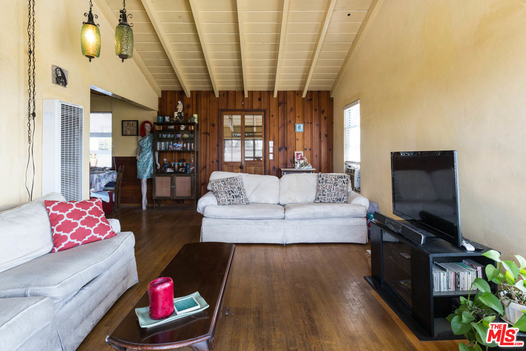 1212 Scenic Drive Glendale, CA 91205 - Photo 21 of 42 a living room with furniture and a flat screen tv
