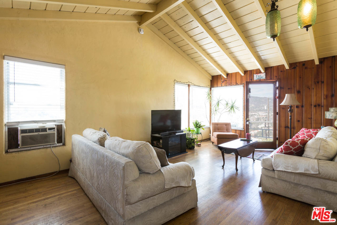 1212 Scenic Drive Glendale, CA 91205 - Photo 22 of 42 a living room with furniture and a flat screen tv