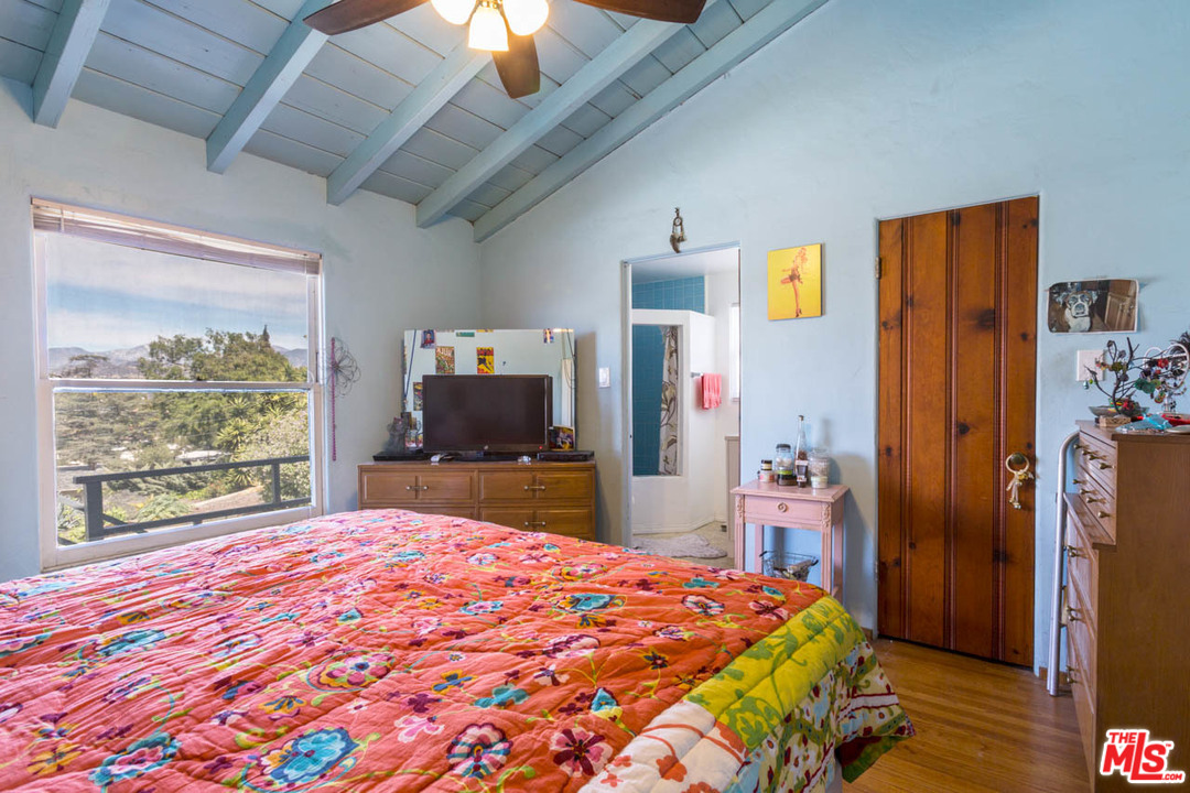 1212 Scenic Drive Glendale, CA 91205 - Photo 26 of 42 a bedroom with a bed and a large window