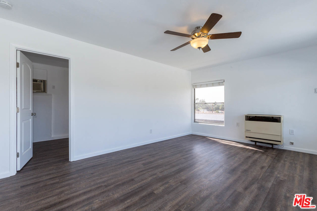 1212 Scenic Drive Glendale, CA 91205 - Photo 5 of 42 a view of room with wooden floor and a ceiling fan