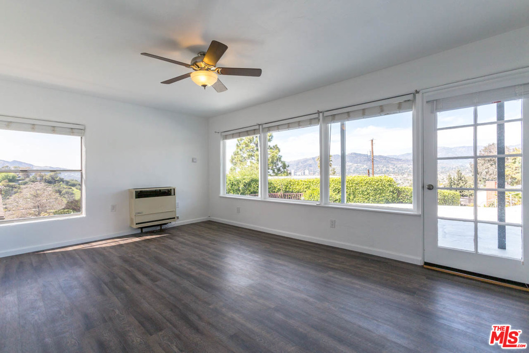 1212 Scenic Drive Glendale, CA 91205 - Photo 6 of 42 a view of an empty room with wooden floor and a window