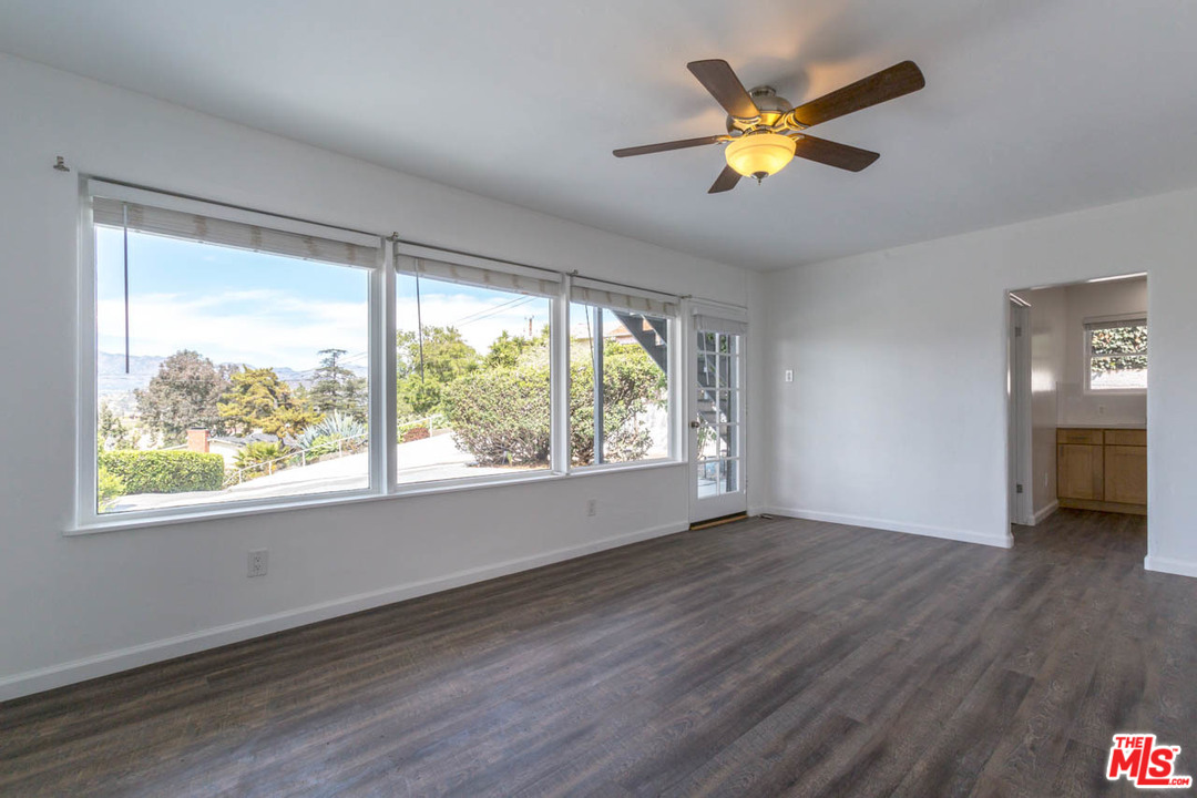 1212 Scenic Drive Glendale, CA 91205 - Photo 7 of 42 a view of an empty room with a window and wooden floor