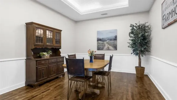 a view of a dining room with furniture and window