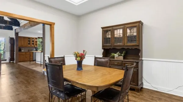 a dining room with furniture and window